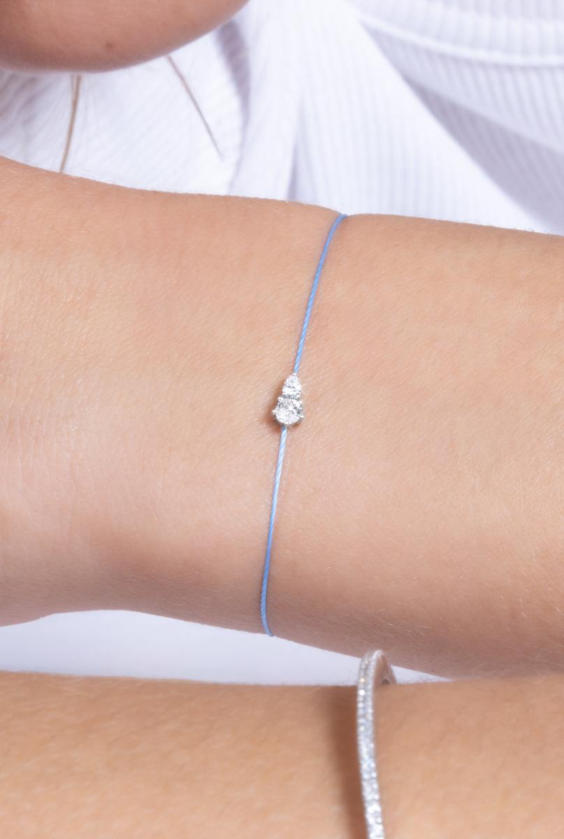 Redline bracelet in white gold with two united diamonds on red
